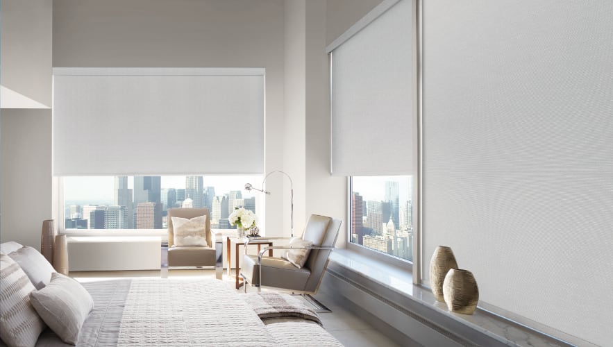 Motorized shades in a bedroom